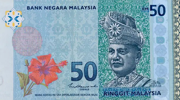 Stock image The blue and green coloured RM50 banknote from the 4th Series shows a portrait of Abdul Rahman of Negeri Sembilan and a national flower red hibiscus on the front side of the note.