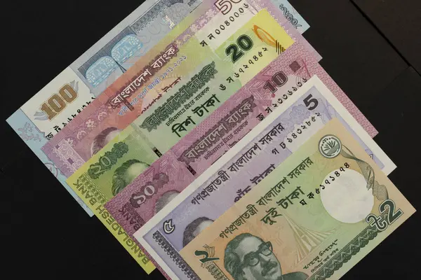 stock image Bangladeshi taka currency notes isolated black background