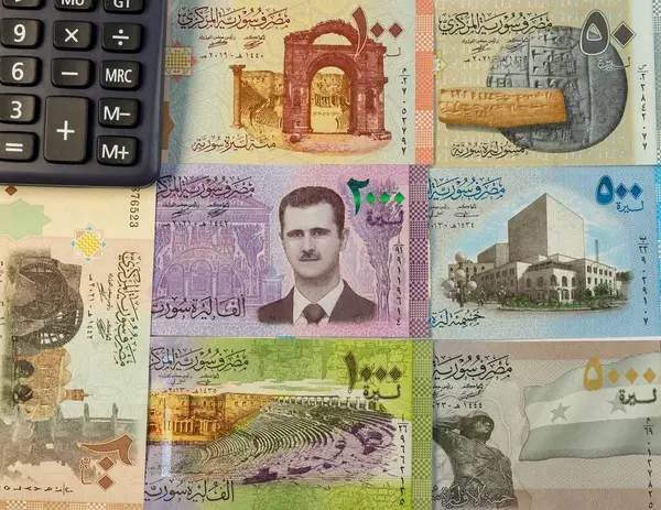 stock image Syrian currency notes with a portrait of president Bashar Al Assad on the center note.