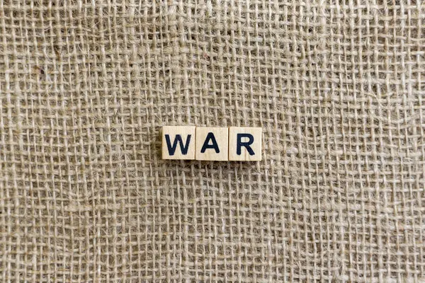 stock image War Message on Wooden Blocks with Burlap Texture