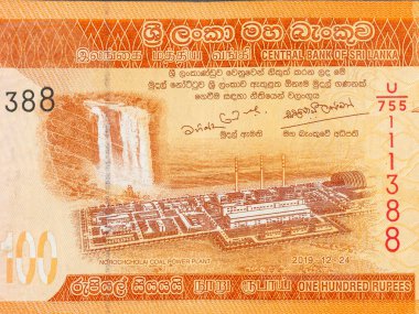 Portrait of Norochcholai coal power plant project and Laxapana waterfall on Sri Lanka 100 rupees currency note clipart