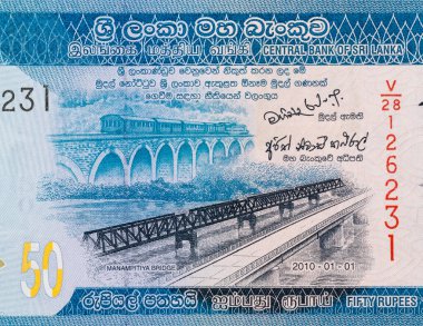 Portrait of newly constructed bridge at Manampitiya alongside the old bridge on Sri Lanka 50 rupees currency note clipart