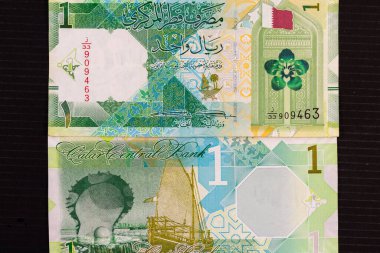 Qatar one riyal new currecny note observe and reverse side from Qatar 1 riyal 2020 banknote. clipart