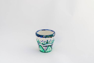 Beautiful hand painted small pot for plants on white isolated background with copy space. clipart