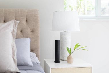 Person in warehouse pouring inside of glass container