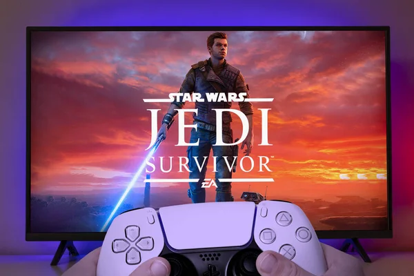 Controlador Playstation Con Logotipo Star Wars Jedi Survivor Pantalla Abr Imagen de stock