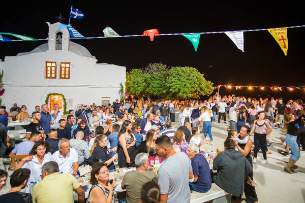 Ios, Greece - September 7, 2022 : A traditional festival in Ios Greece where locals and tourists celebrating the Holy Mary at the church of Theodoti