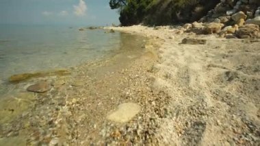 Kriopighi, Greece - August 31, 2022 : The crystal clear waters of the Kriopigi beach in Chalkidiki Greece