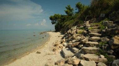 Kriopighi, Greece - August 31, 2022 : The crystal clear waters of the Kriopigi beach in Chalkidiki Greece