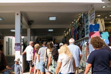Santorini, Greece - September 16, 2022 : View of tourists queuing up in line for the cable car in Fira Santorini Greece