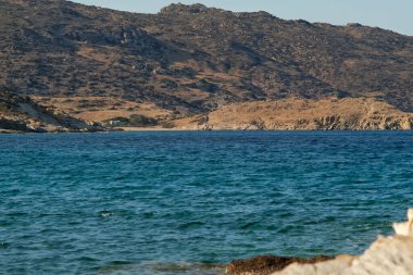 Panoramic view of the amazing golden sand and clear waters at the beautiful beach of Kalamos in Ios Greece