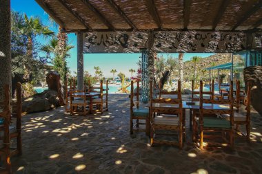 Ios, Greece - June 6, 2021 : View of an outdoor restaurant of a luxury hotel with a unique decoration in Ios Greece