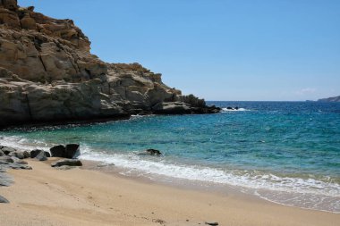 The beautiful dream turquoise sandy beach of Sapounohoma in Ios Greece