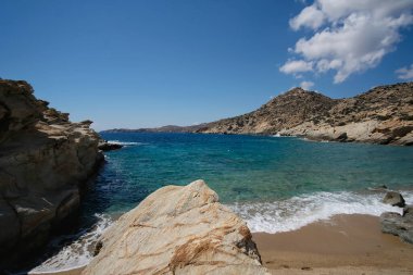 The beautiful dream turquoise sandy beach of Sapounohoma in Ios Greece