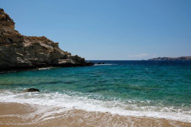The beautiful dream turquoise sandy beach of Sapounohoma in Ios Greece
