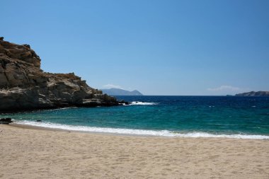 The beautiful dream turquoise sandy beach of Sapounohoma in Ios Greece