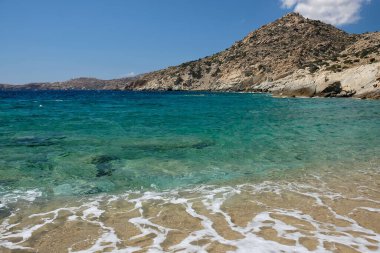 The beautiful dream turquoise sandy beach of Sapounohoma in Ios Greece