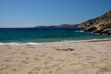 The beautiful dream turquoise sandy beach of Sapounohoma in Ios Greece