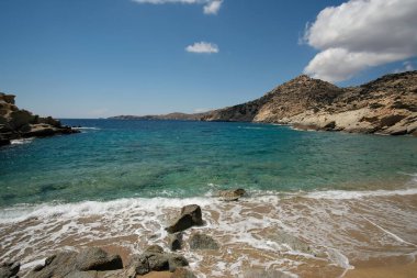 The beautiful turquoise sandy beach of Sapounohoma in Ios Greece