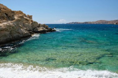 The beautiful turquoise sandy beach of Sapounohoma in Ios Greece