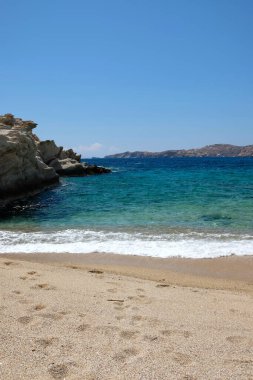 The beautiful turquoise sandy beach of Sapounohoma in Ios Greece