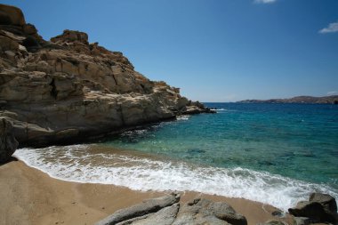 The beautiful turquoise sandy beach of Sapounohoma in Ios Greece