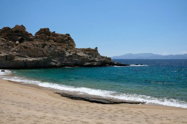 The beautiful turquoise sandy beach of Sapounohoma in Ios Greece