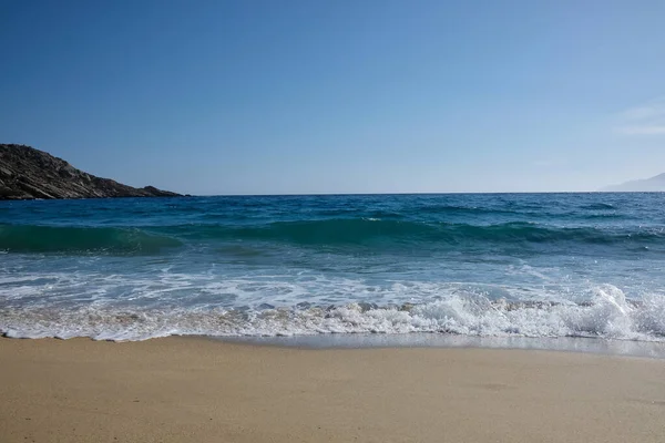 Stock image Waves and sea foam at the beautiful beach of Mylopotas in Ios Greece