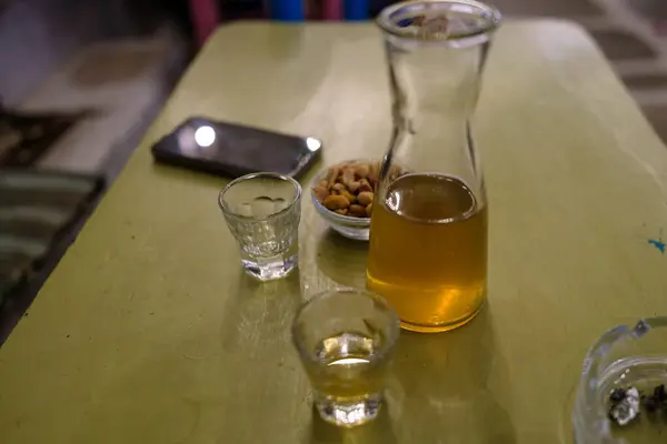 Rakomelo, a Greek alcoholic beverage combining raki or tsikoudia with honey, cinnamon and other herbs
