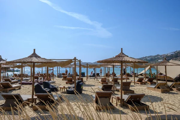 stock image Ios, Greece - September 8, 2023 : View of luxury sun beds and sun umbrellas at the famous Mylopotas beach in Ios Greece