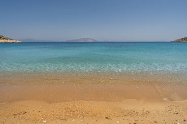 View of the popular and beautiful sandy beach of Gialos in Ios cyclades Greece clipart