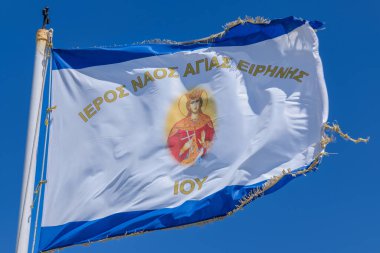 View of the flag of the holy temple Saint Irene in Ios Greece clipart