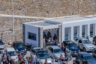 Kythnos, Greece - May 6, 2024 : View of tourists waiting to embark on a ferry boat on the  island of Kythnos Cyclades Greece clipart