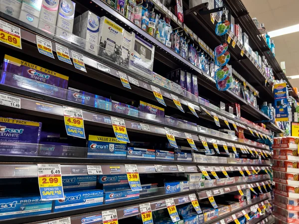 stock image Seattle, WA USA - circa August 2022: Angled, selective focus on a variety of toothpastes for sale inside a QFC grocery store.