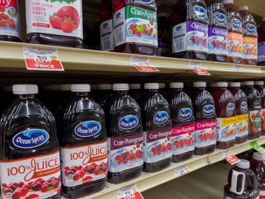 Seattle, WA USA - circa December 2022: Angled view of Ocean Spray juice products for sale inside a grocery store.