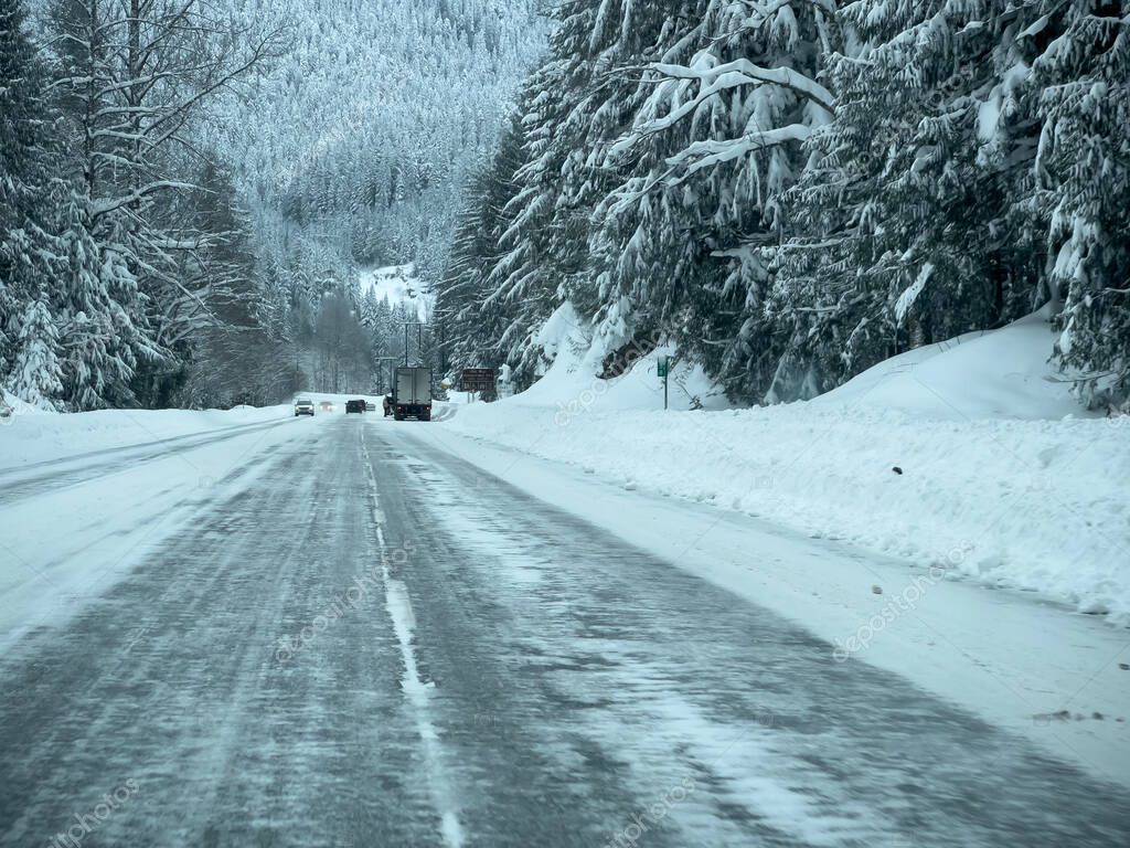 Stevens Pass, WA USA circa December 2022 Wide view of poor road