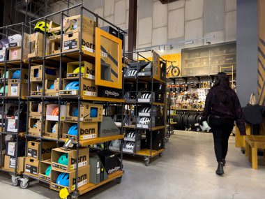 Bellevue, WA USA - circa December 2022: Wide view of people shopping inside an REI outdoors store.