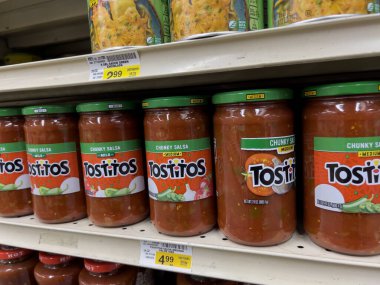 Seattle, WA USA - circa november 2022: Close up view of jarred salsas for sale inside a grocery store.