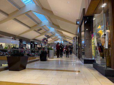 Bellevue, WA USA - circa December 2022: Wide view of people shopping inside the Bellevue Mall.