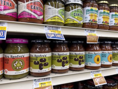 Seattle, WA USA - circa november 2022: Close up view of jarred salsas for sale inside a grocery store