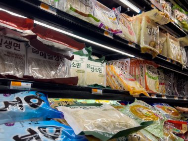 Lynnwood, WA USA - circa December 2022: Close up view of fresh, refrigerated noodles for sale inside an H Mart grocery store.