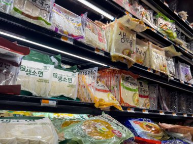 Lynnwood, WA USA - circa December 2022: Close up view of fresh, refrigerated noodles for sale inside an H Mart grocery store.