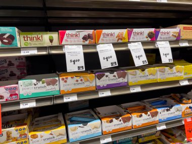 Mill Creek, WA USA - circa November 2022: Close up view of energy and protein bars for sale inside a Town and Country Market.