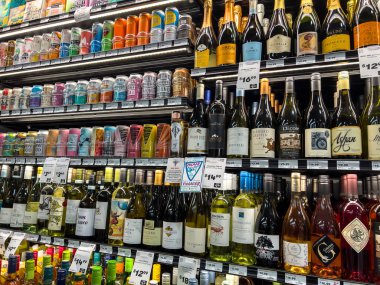 Mill Creek, WA USA - circa December 2022: Close up view of refrigerated wine products for sale inside a Town and Country grocery store.