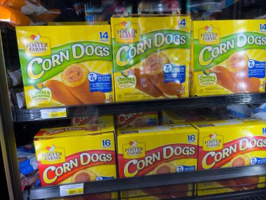 Woodinville, WA USA - circa November 2022: Close up view of corn dogs for sale inside the freezer section of a Haggen store.