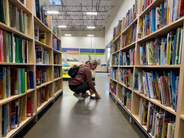 Monroe, WA USA - circa December 2022: Wide view of people shopping inside a Goodwill thrift shop.