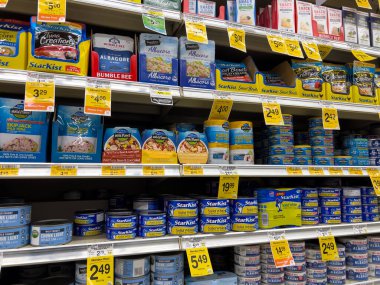Leavenworth, WA USA - circa December 2022: Wide view of a variety of canned seafood products for sale inside a Safeway grocery store.