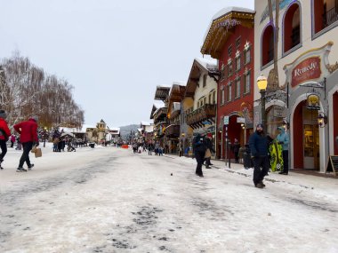 Leavenworth, WA USA - circa December 2022: Wide view of families with children exploring the downtown shopping in Leavenworth