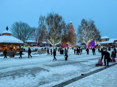 Leavenworth, WA USA - circa December 2022: Wide view of people shopping in the downtown area of Leavenworth.