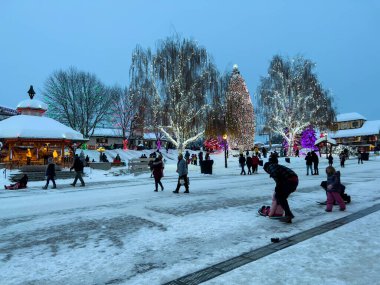 Leavenworth, WA USA - circa December 2022: Wide view of people shopping in the downtown area of Leavenworth.